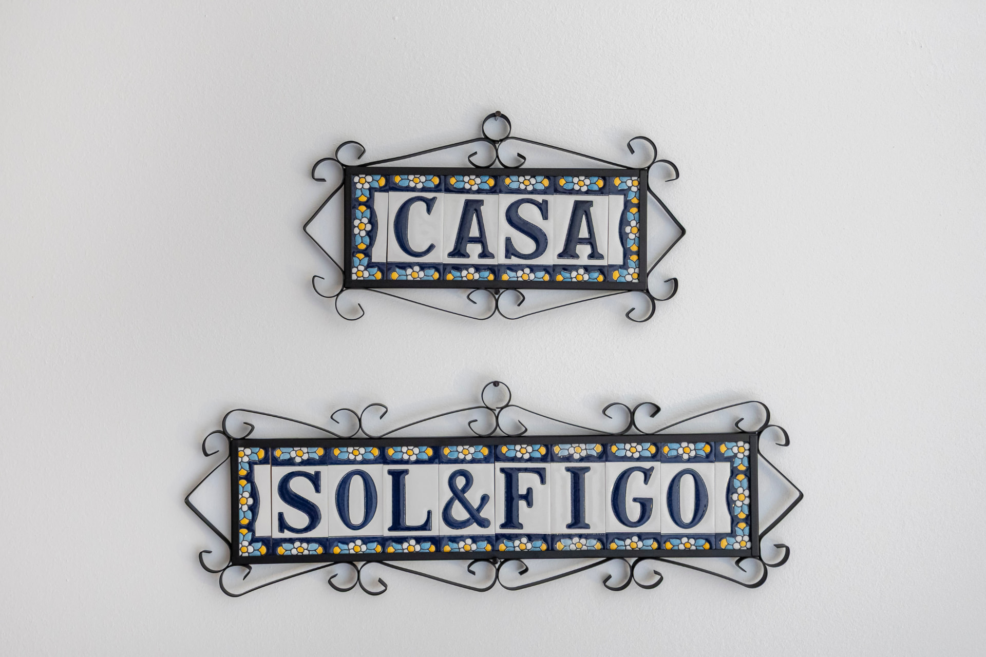 Hand-painted Portuguese tile plaques reading Casa Sol & Figo